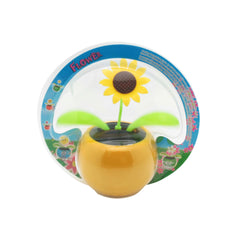 Solar Dancing Flower Pot Toy featuring a cheerful sunflower and vibrant green leaves.