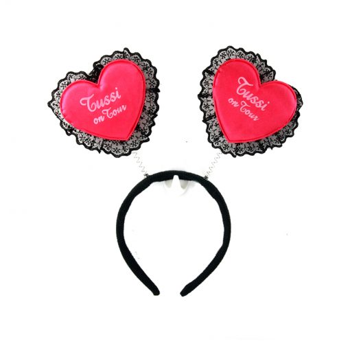 Heart Hair Band featuring playful red heart embellishments on a black headband.