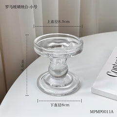 Clear glass Candle Holder S.K. with a round base and elegant design, perfect for home decor.