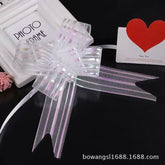 Pulling Ribbon(10PCS/3*47CM) displayed as a decorative bow next to a photo frame and a heart card.