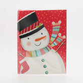 X-mas Melody Card(XC265) featuring a cheerful snowman on a red background with festive patterns and colors.