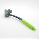 B.S Brush with a grey and green handle designed for efficient cleaning and scrubbing.