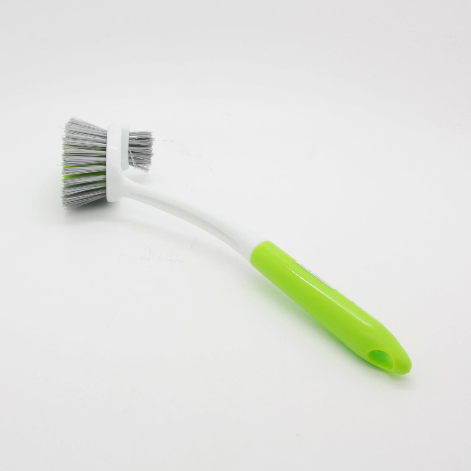 B.S Brush with a green handle and grey bristles, ideal for cleaning and scrubbing surfaces.