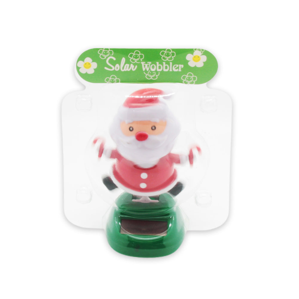 Solar Dancing Christmas Dashboard Toy with Santa wobbler on a green base, perfect for festive decoration.