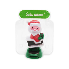 Solar Dancing Christmas Dashboard Toy featuring a cheerful Santa wobbler in a sleigh.