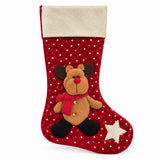 Red Christmas stocking with reindeer and gold cuff