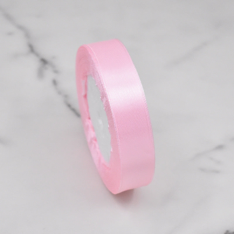🧵 Premium Satin Ribbon – Versatile & Elegant in soft pink color, perfect for gift wrapping and crafting.