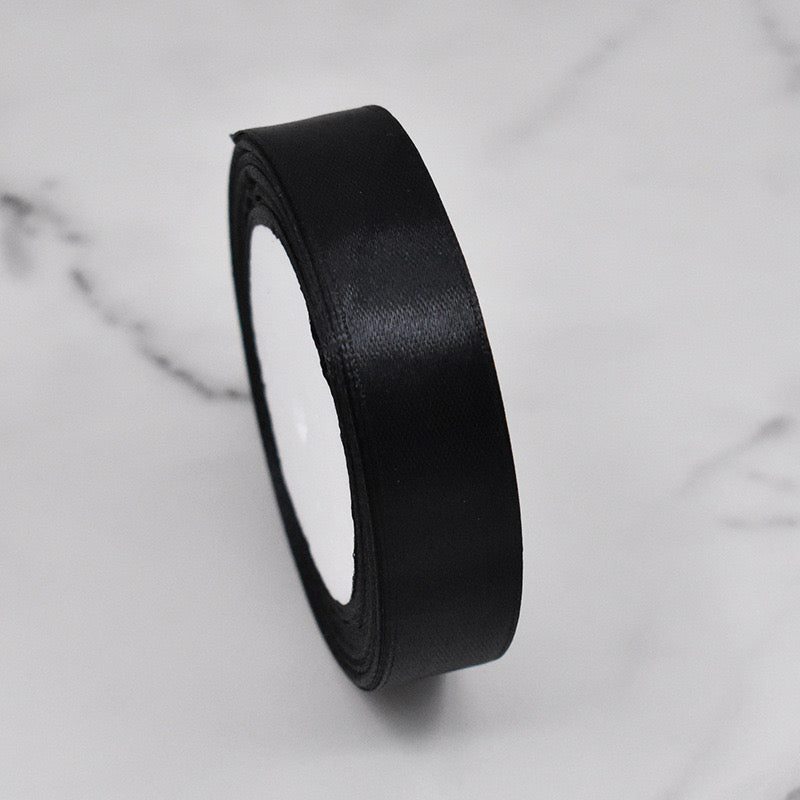 🧵 Premium Satin Ribbon – Versatile & Elegant in sleek black, perfect for elegant gift wrapping and crafting.