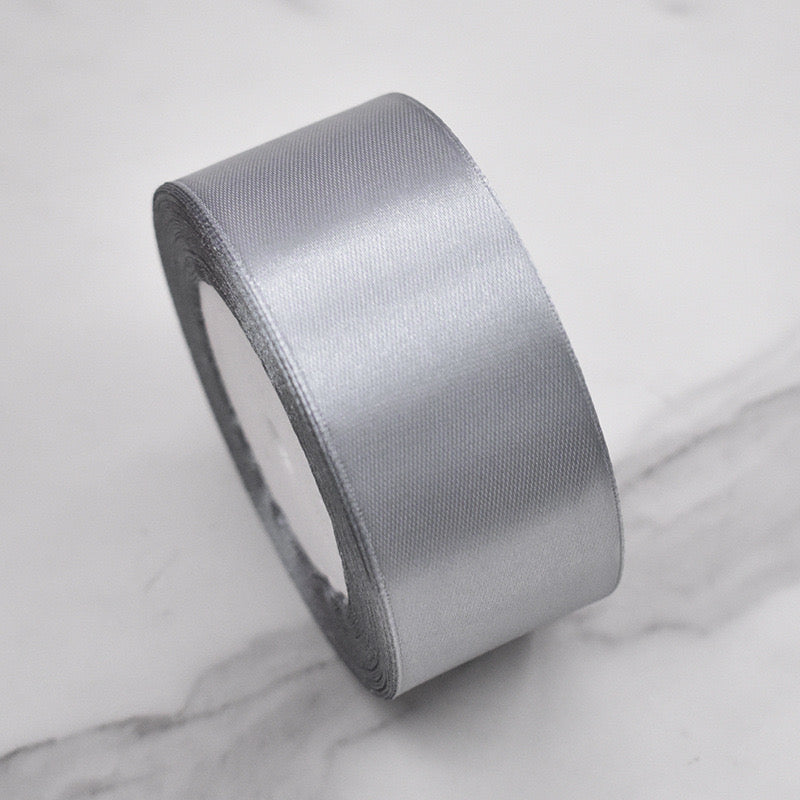 🧵 Premium Satin Ribbon – Versatile & Elegant in silver color, perfect for gift wrapping and DIY crafts.