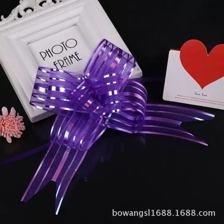Pulling Ribbon(10PCS/3*47CM) displayed as a decorative purple bow with shiny stripes.