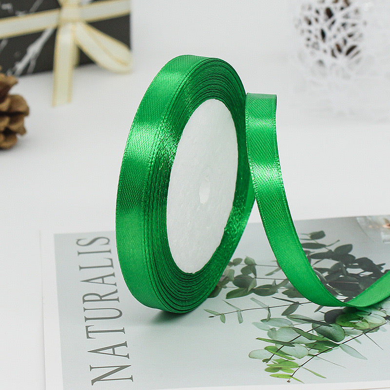 🧵 Premium Satin Ribbon – Versatile & Elegant in vibrant green, ideal for gift wrapping and craft projects.