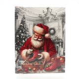 X-mas Melody Card(XC383) featuring Santa Claus painting a red boot by a Christmas tree.