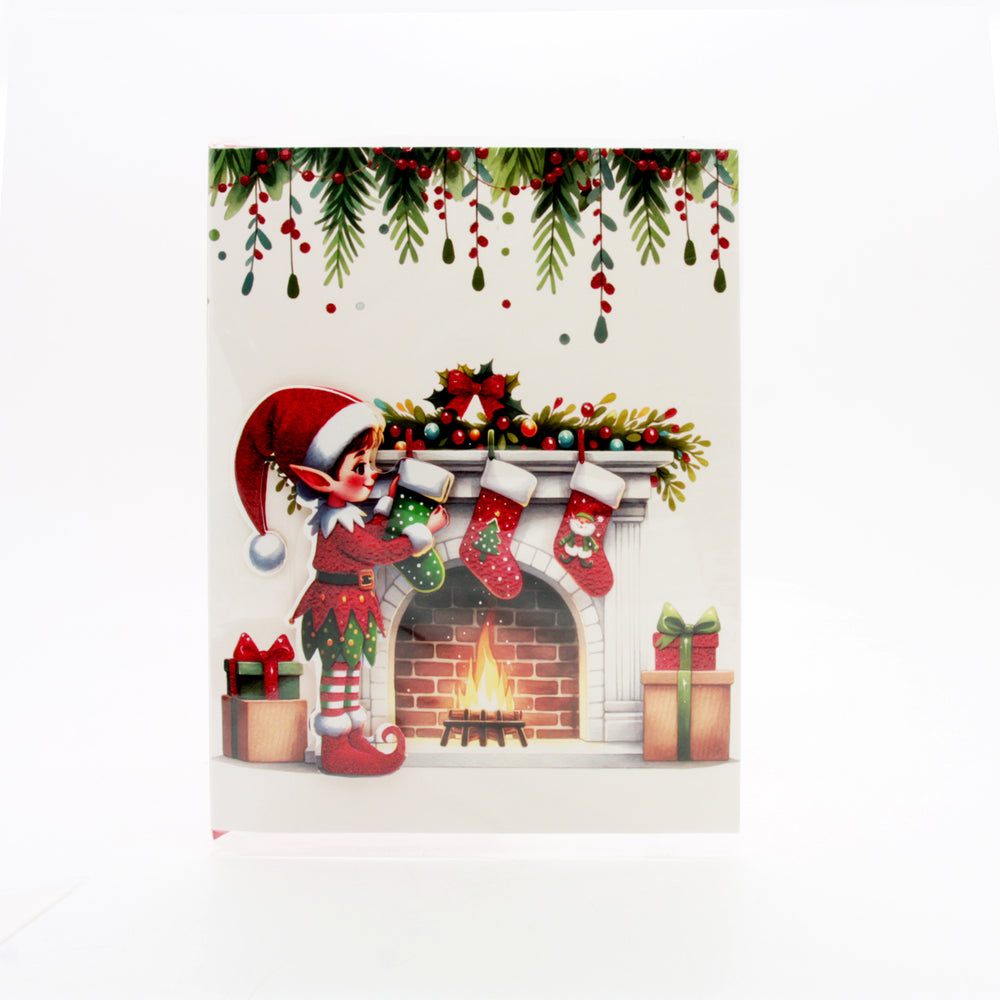 X-mas Melody Card(XC365) featuring a festive elf decorating a Christmas mantel with stockings.