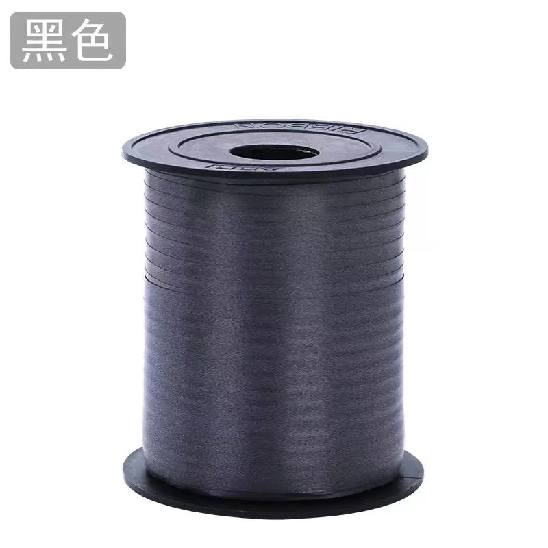 Curling Ribbon Roll(0.5CM*200M/Black) on a spool, ideal for gift wrapping and craft projects.