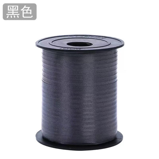 Curling Ribbon Roll(0.5CM*200M/Black) on a spool, ideal for gift wrapping and craft projects.