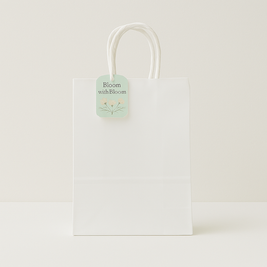 🛍️ Premium Paper Gift Bags – 4-Pack Assorted Colors (12*14*6CM) - Elegant white gift bag with floral tag and handles.